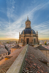 Baroque bell tower and dome of the La Clerecia building at sunset in the city of Salamanca, Spain.
