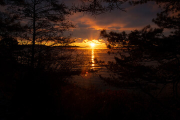 Naklejka premium sunset over the river