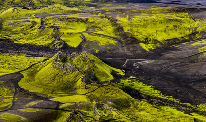 Lakagígar row of spectacular green craters against black lava , Iceland