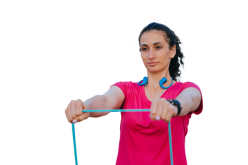 confident American girl does sports against transparent background using rubber hinges, looks into the distance, thinks about the upcoming competitions, prepares. Healthy people, athlete.