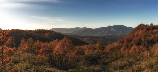 panorama mountain and forest landscape in fall foliage colours in the hills of Abruzzo