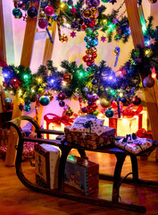 Colorful Christmas decoration on a wooden ladder as an alternative to a Christmas tree.