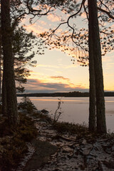 winter lake with snow at sunset