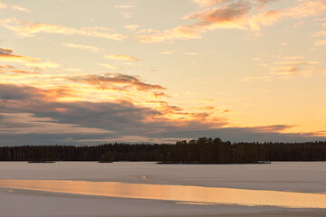 winter lake with snow at sunset