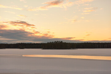 sunset over a lake in winter