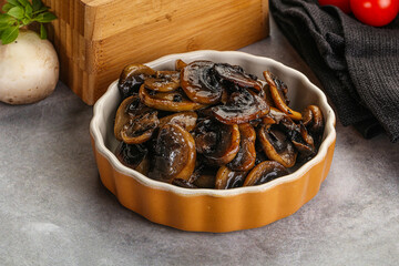 Roasted champignon mushrooms in the bowl