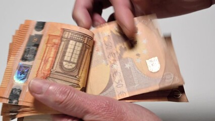 closeup of woman counting fifty euro banknotes