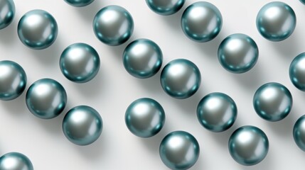 A group of shiny blue pearls on a white surface.