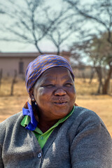 portrait of happy overweight village old african woman , Botswana rural area