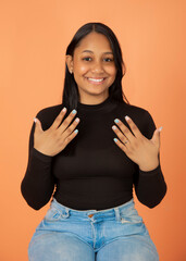 excited latin girl showing her nails