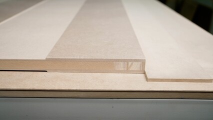 Wooden door, production of interior doors. The door lies on the packing table. Wooden door blank, in production.