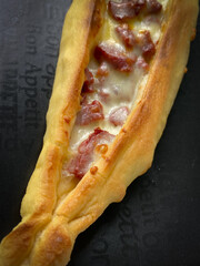 Traditional Turkish home made pita bread with sausage and cheese. Traditional turkish cuisine baked dish pide. local delicacies, Turkish pizza.