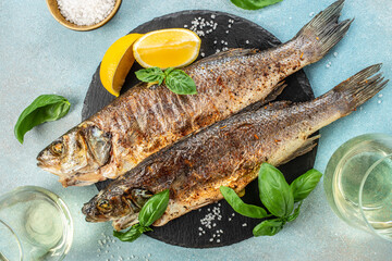 Grilled sea bass fish with lemon herbs and spices, banner, menu recipe place for text, top view