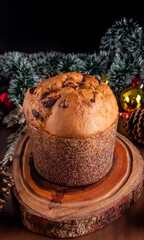 Delicious panettone (Chocottone) with chocolate chips on wooden table