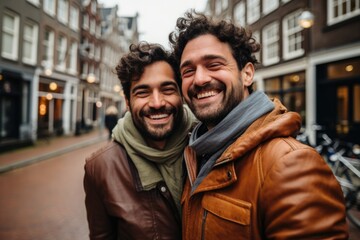 Portrait of happy gay male couple in the city street