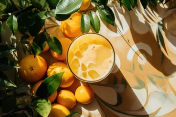 Foto op Plexiglas Freshly Squeezed Orange Juice and Oranges on a Rustic Table © Baba Images