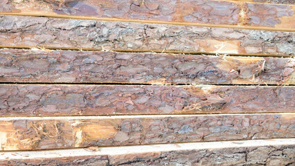  stack of raw boards as sawmill products, wooden natural texture background