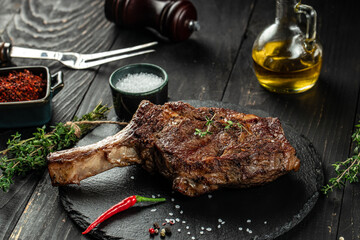 Barbecue Tomahawk Steak on a dark background. top view. copy space for text