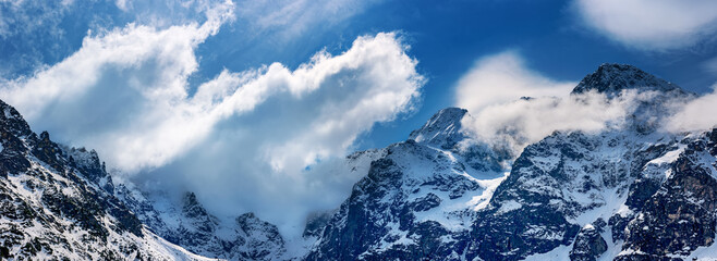 Mountain peaks near Morskie Oko or Sea Eye Lake in Poland at Winter. Tatras range - obrazy, fototapety, plakaty