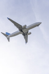 Fototapeta na wymiar A jet passenger plane approaching the runway of an airport