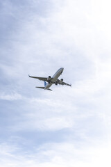 Fototapeta na wymiar A plane approaching the landing strip of an airport