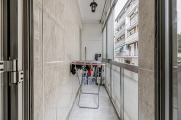 A narrow terrace with aluminum and glass windows - obrazy, fototapety, plakaty