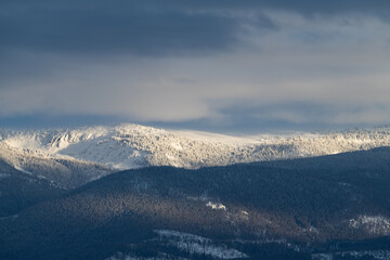 Mid Winter snow storm on the Indian Peaks Mountain Range, provides a dramatic mysterious backdrop above the Fraser Valley.  