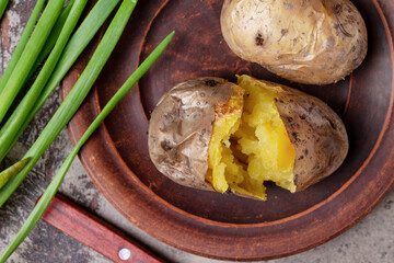 baked potatoes, green onions, rustic dinner, top view