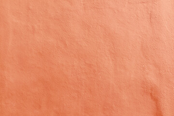 textutre of concrete painted in Peach Fuzz wall background,