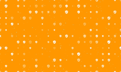 Seamless background pattern of evenly spaced white protection mark symbols of different sizes and opacity. Vector illustration on orange background with stars