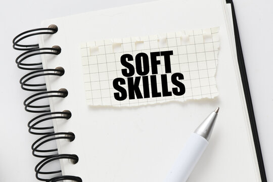 SOFT SKILLS on a piece of paper placed on the notebook. Concept for business.