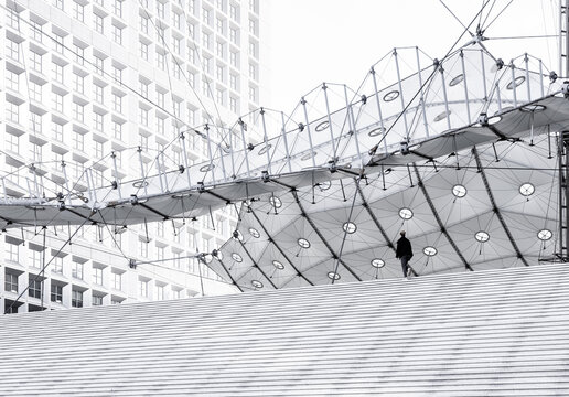 Paris, France: silhouette at the stairs of La Defense Grand Arche