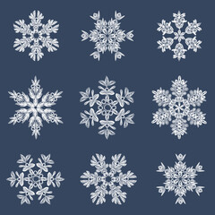 Fototapeta na wymiar A set of stylish white quilling snowflakes on a dark blue background. Paper openwork weaving technique. Elements of quilling. New Year's symbols in the pattern.