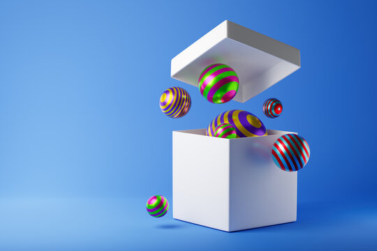 White open box with falling out colorful striped balls or geometric spheres isolated over blue background. 3D rendering.