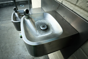 Classic American stainless steel drinking fountains installed at different heights