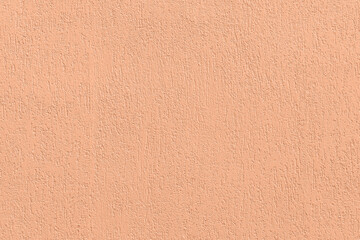 Peach background with rough texture for your design. Showcasing the color of 2024.