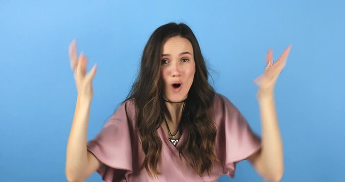 Mind blowing information. Girls world falling apart as she realise everyone hid truth. Shocked and overwhelmed woman making explosion gesture as her head gonna explode isolated on blue, wtf.