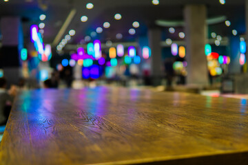 wooden table close up with blurred bokeh background in a mall
