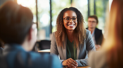 A Diversity and Inclusion Manager facilitating a group discussion on inclusive practices, Diversity and inclusion manager, blurred background, with copy space