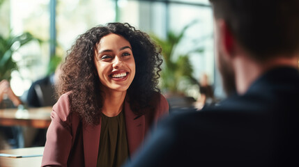 A Diversity and Inclusion Manager in a casual conversation with diverse employees in the cafeteria, Diversity and inclusion manager, blurred background, with copy space