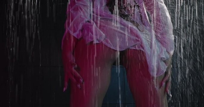 Wet erotic woman moving sexually in the shower. Provocative sexy woman sensual moves in lingerie. Slow motion