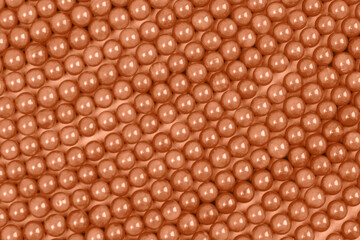Necklaces and bracelets made from coral. Background, texture. Demonstrating color of the year 2024 Peach Fuzz