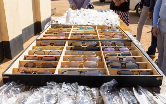 rack with eye glasses on a table, used for a charity event to distribute to the poor people