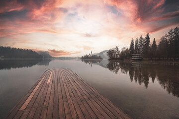lake bled slovenia sunset clouds and light landscape with reflections