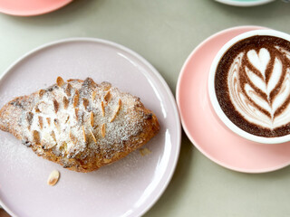 Close up of hot chocolate with almond croissant