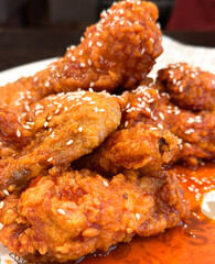 Close up of crispy fried chicken with sweet chilli sauce 