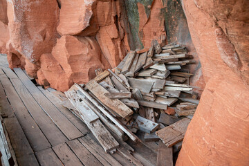 old wood planks and wood blocks pile up outside, at construction sites.