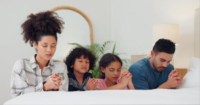 Bedroom, family and praying with faith, children or worship with God, bonding together or home. Parents, mother or father with kids, night or relax with unity, spiritual or religion with Christianity