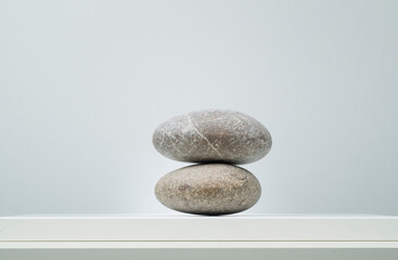 minimalistic light background with stones for product presentation