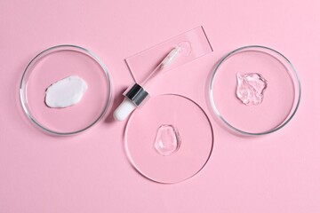 Obraz na płótnie Canvas Pipette, cosmetic serum and petri dishes with samples on pink background, flat lay